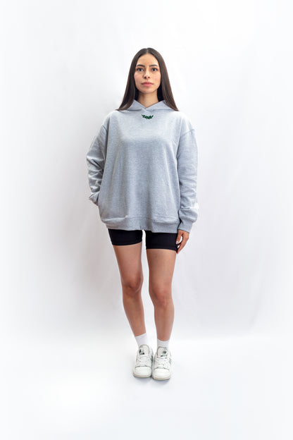 An athletic individual donning a heavyweight grey hoodie adorned with the Sartorial Athletics logo in the front, showcasing its versatile blend of sartorial quality and athletic aesthetics. Elevate your casual, vintage, or aesthetic outfits effortlessly with this premium-quality hoodie from Sartorial Athletics.