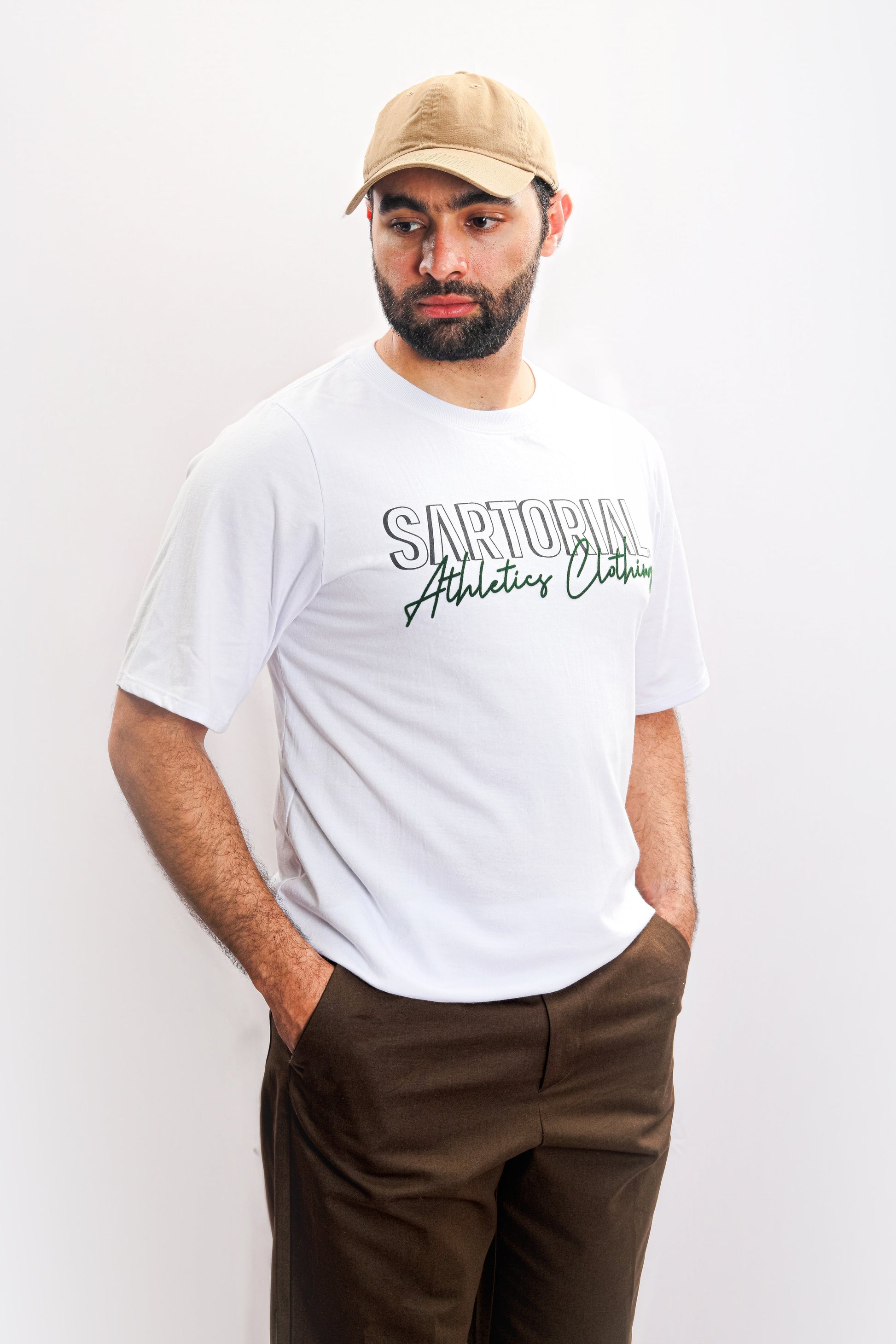 A versatile white t-shirt adorned with the Sartorial Athletics logo in the front, showcasing the brand's signature quality and athletic aesthetic. Elevate your outfit with this Sartorial Athletics staple crafted for both style and performance.